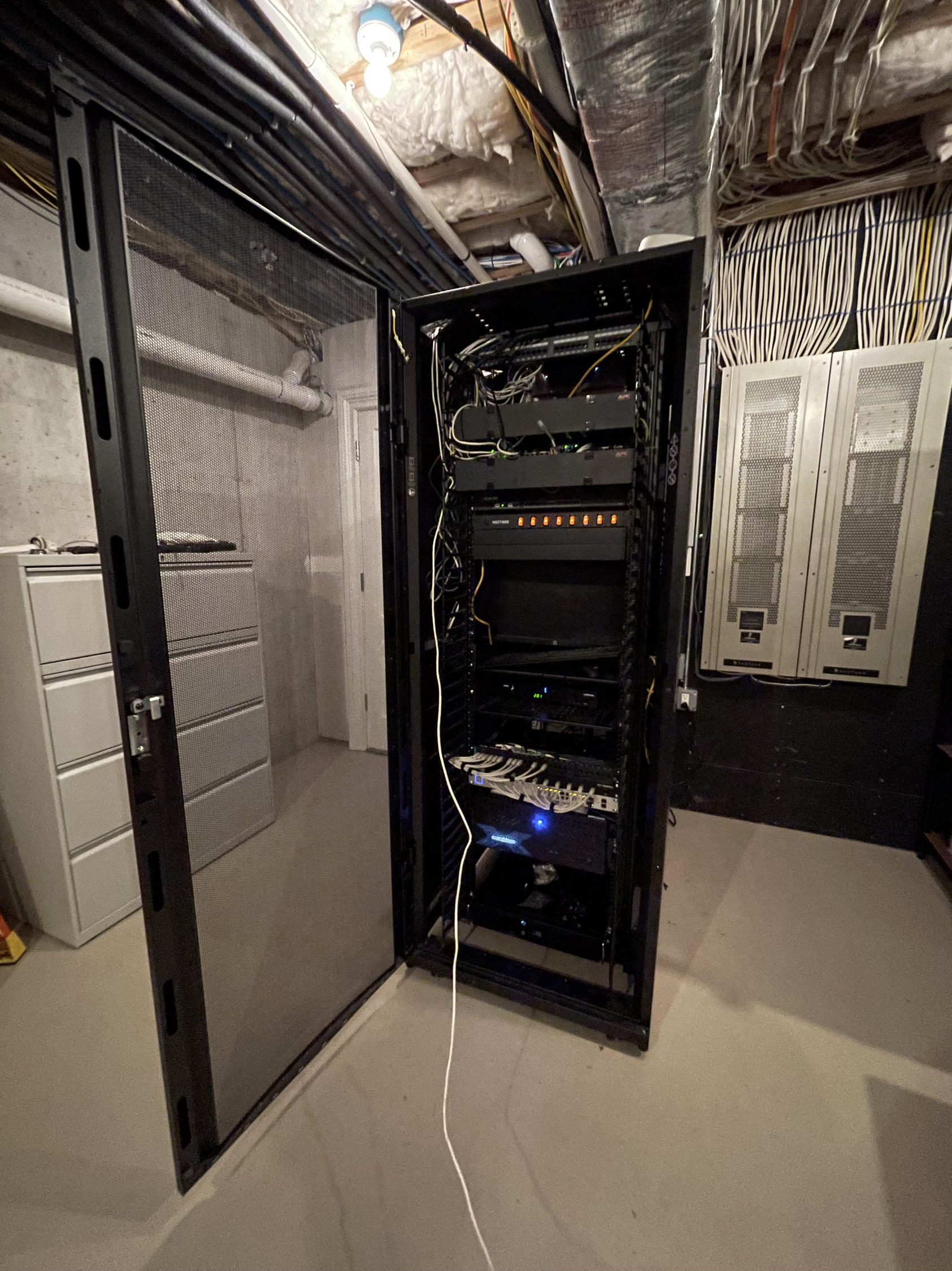 A server room with a glass door and a zebra print wall.