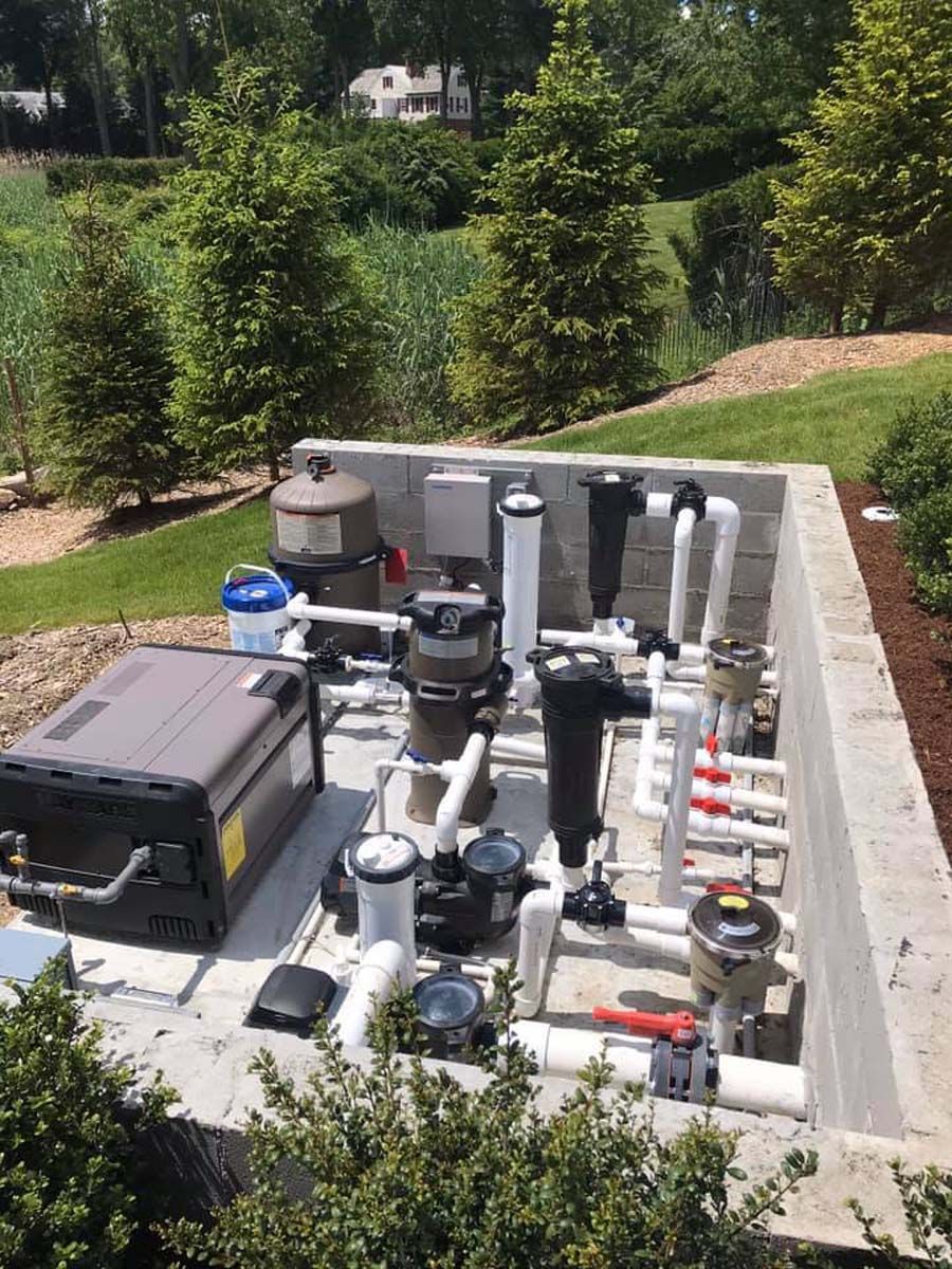 A swimming pool system is being built in a concrete bunker.