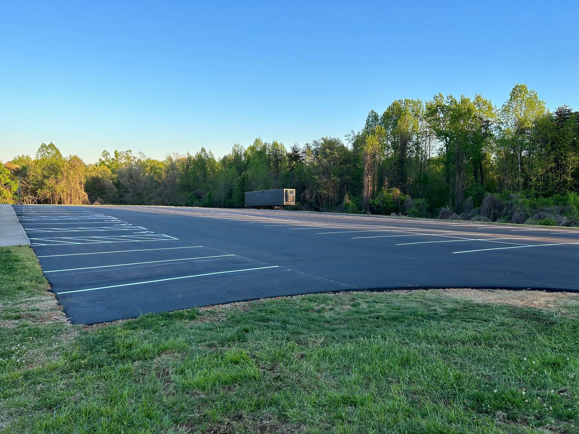 a road with a lot of grass on the side of it