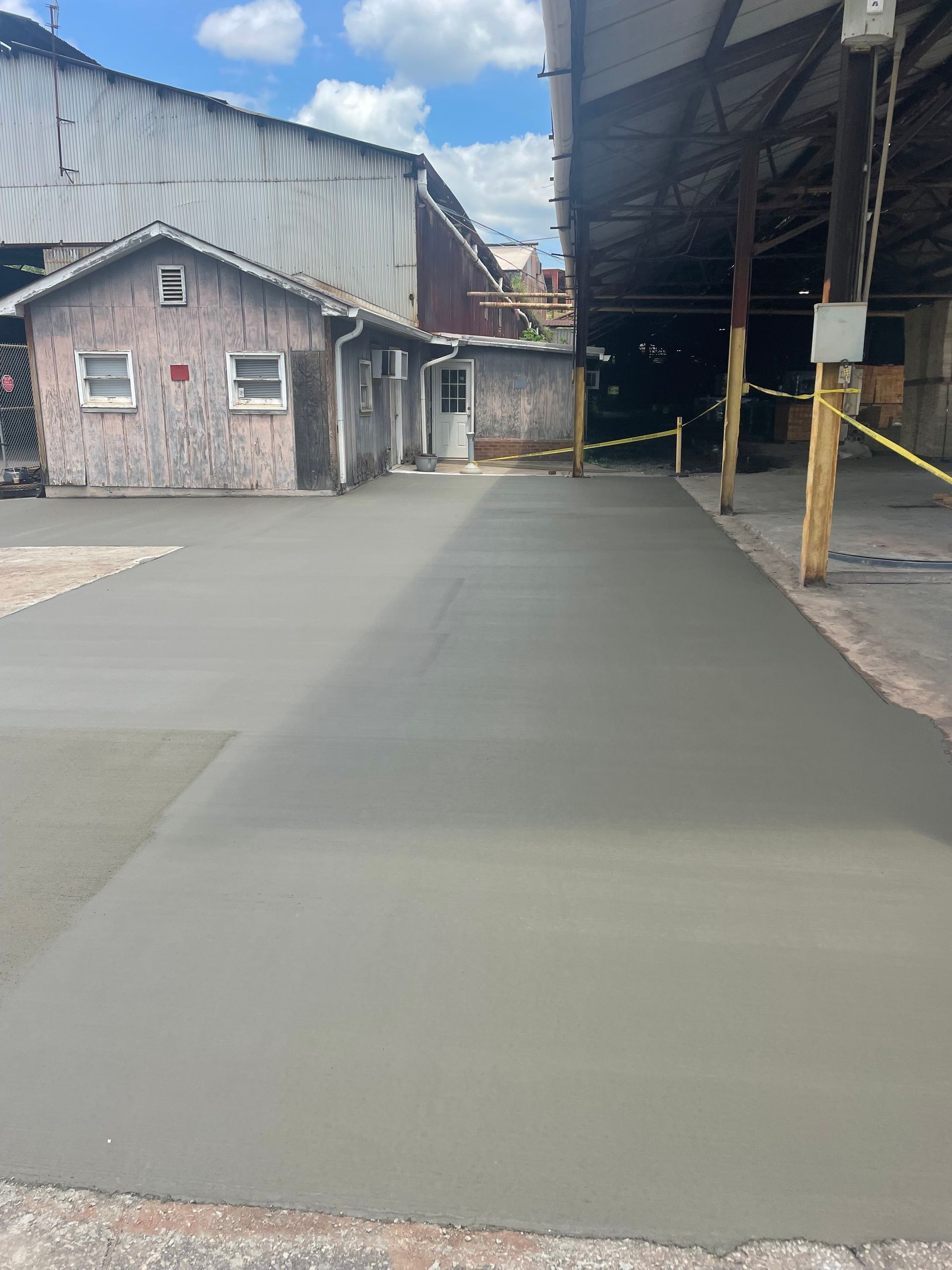 a concrete driveway is being built in front of a building