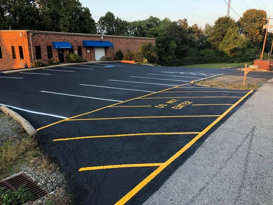 a parking lot with a building in the background