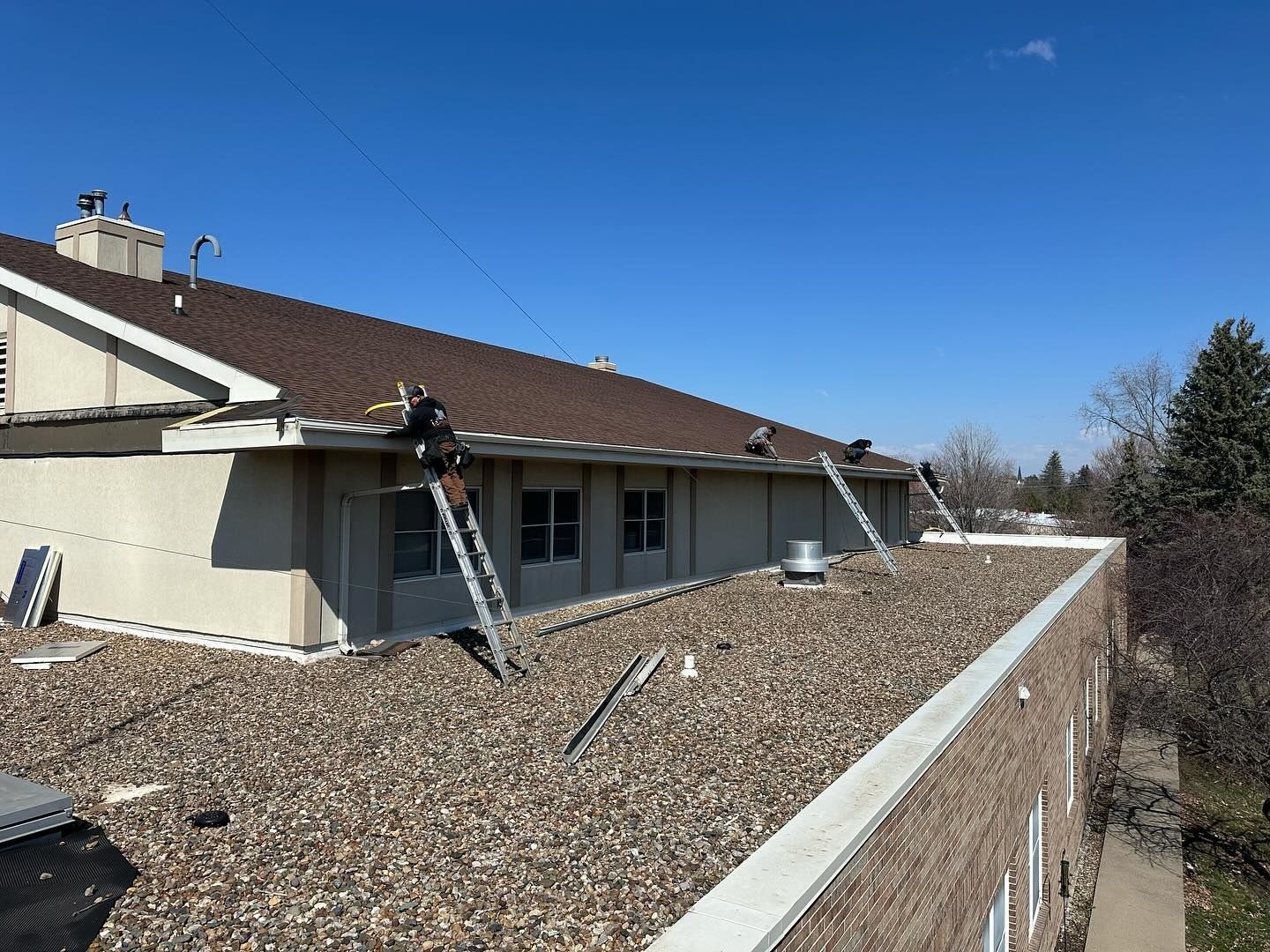 A building with a roof that is covered in gravel.