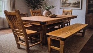 Wooden dining table set with benches and chairs in a cozy room