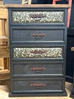 Black narrow dresser with five drawers and floral panels, standing indoors.