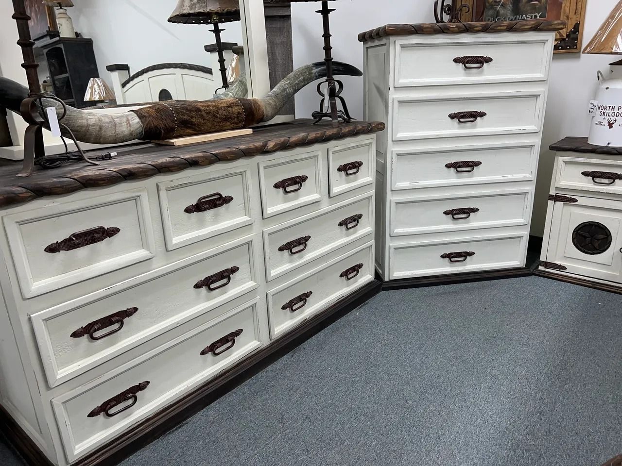 White rustic bedroom furniture set with brown tops, drawers, and handles.