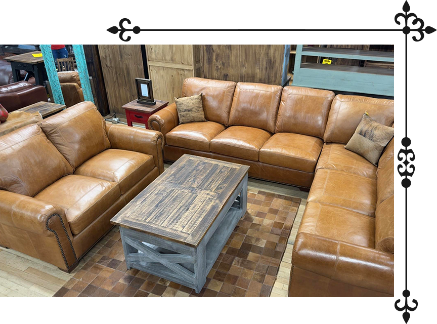 Brown leather sectional sofa and matching armchair, coffee table, in a furniture store.