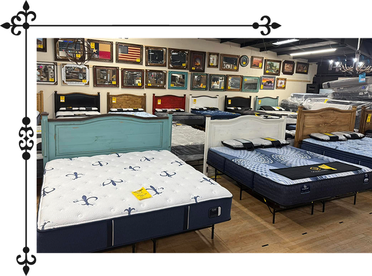 Mattresses on display in a showroom with colorful headboards and framed art on the wall.