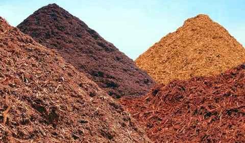 three piles of mulch are stacked on top of each other