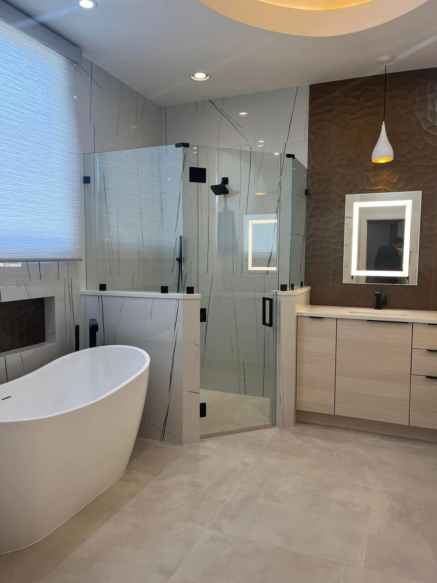 Modern bathroom with a white tub, glass shower, light wood vanity, and brown textured wall.