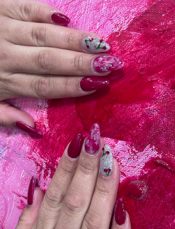 A close up of a person 's nails on a pink background.