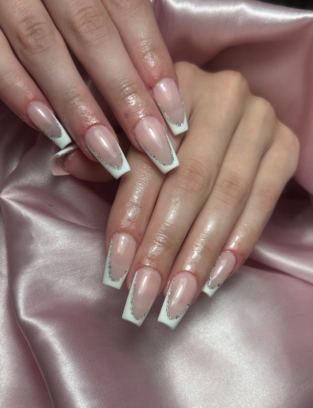 A close up of a person 's nails on a pink cloth.