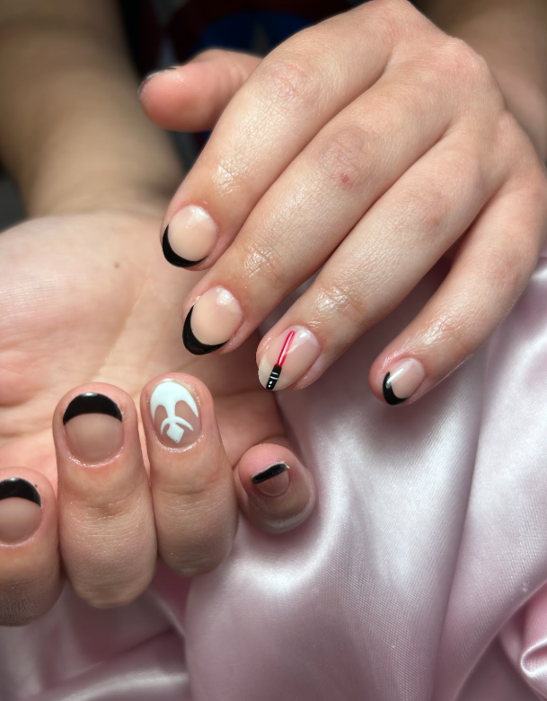 A close up of a person 's nails on a pink cloth.