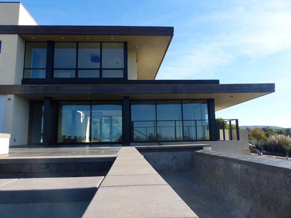 A large house with a lot of windows and stairs