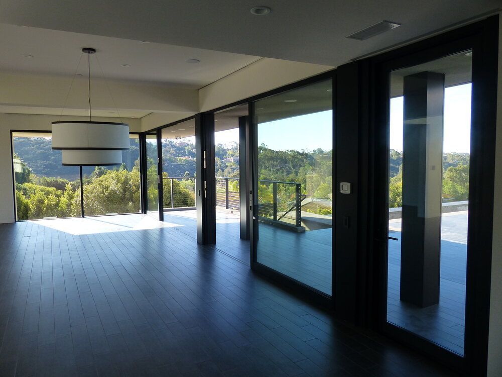 A large empty room with a lot of windows
