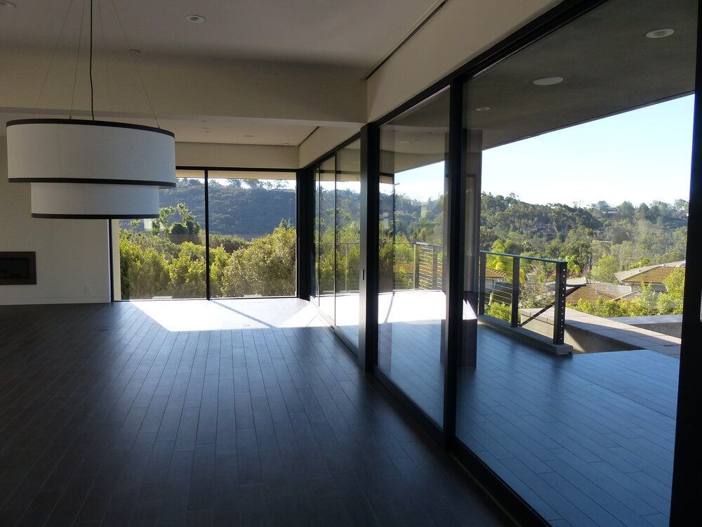 A large empty room with a lot of windows