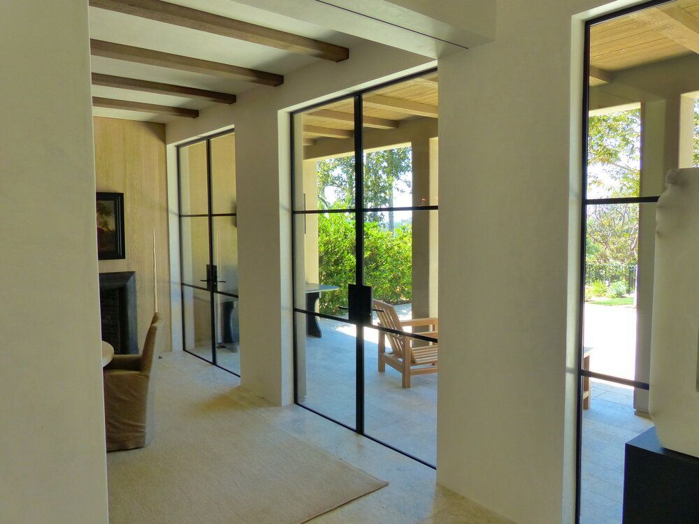 A hallway with sliding glass doors leading to a patio.