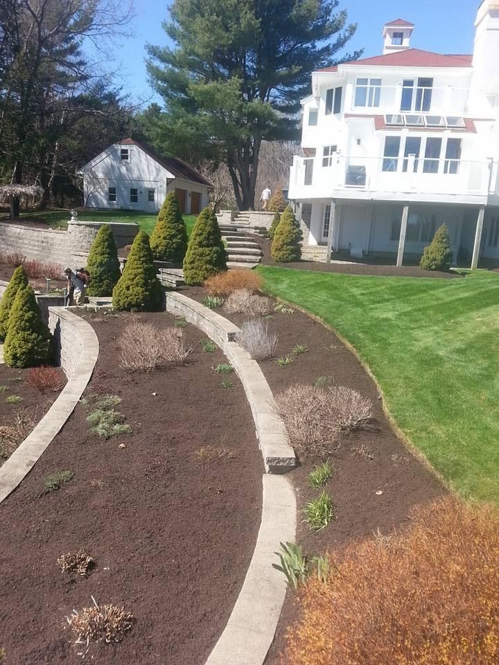 a large white house with a large lawn in front of it