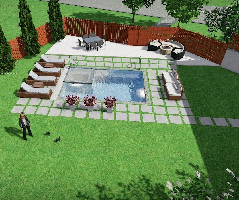 An aerial view of a backyard with a large swimming pool