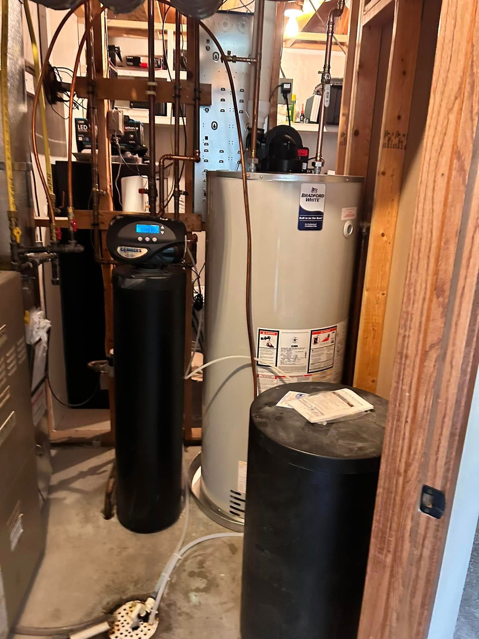 A bunch of water heaters are sitting in a room.