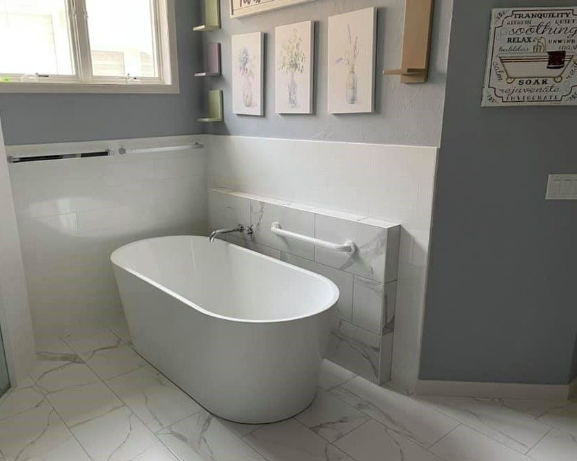 There is a bathtub in the middle of the bathroom.