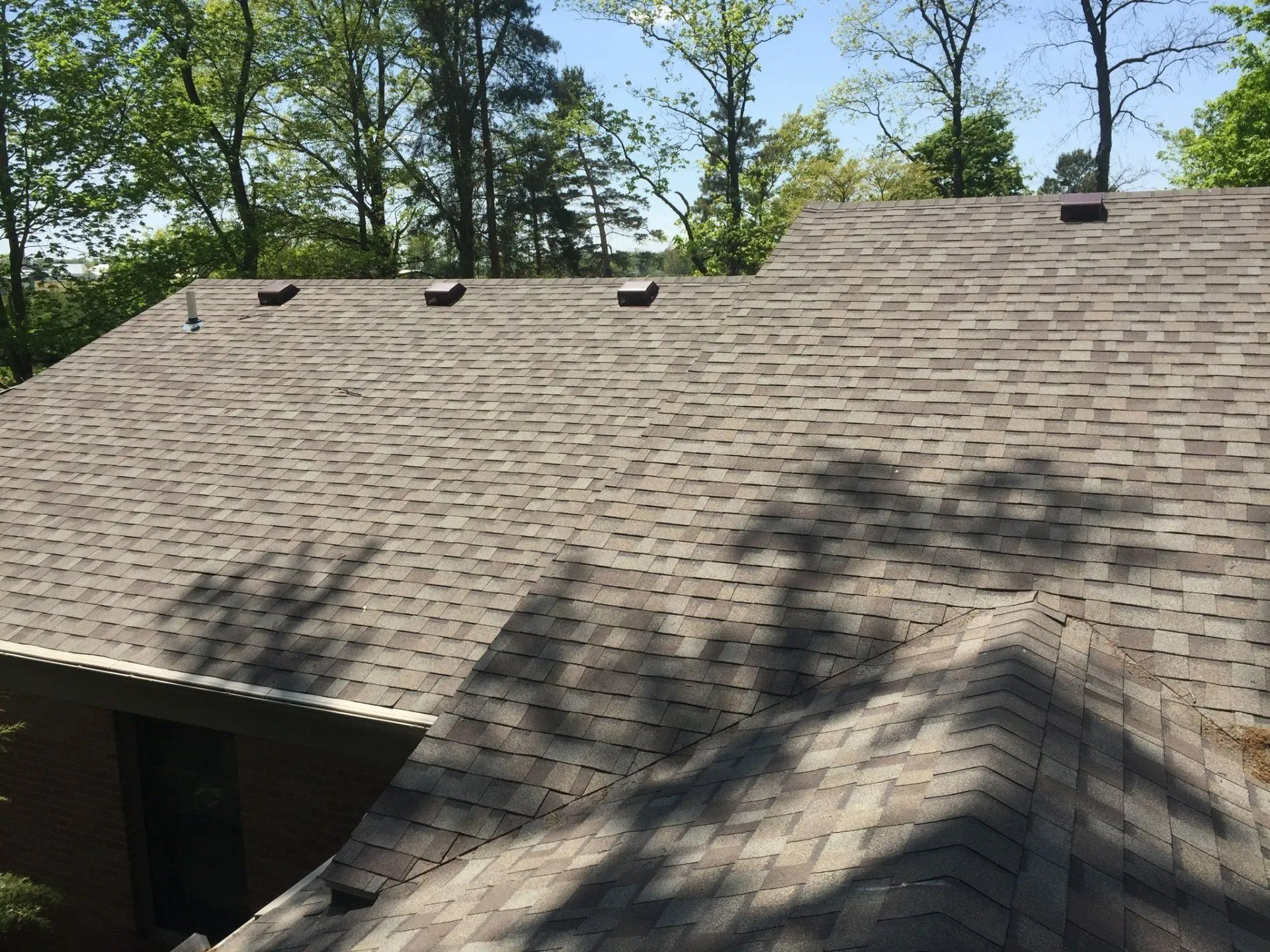Brick wall and asphalt roofing