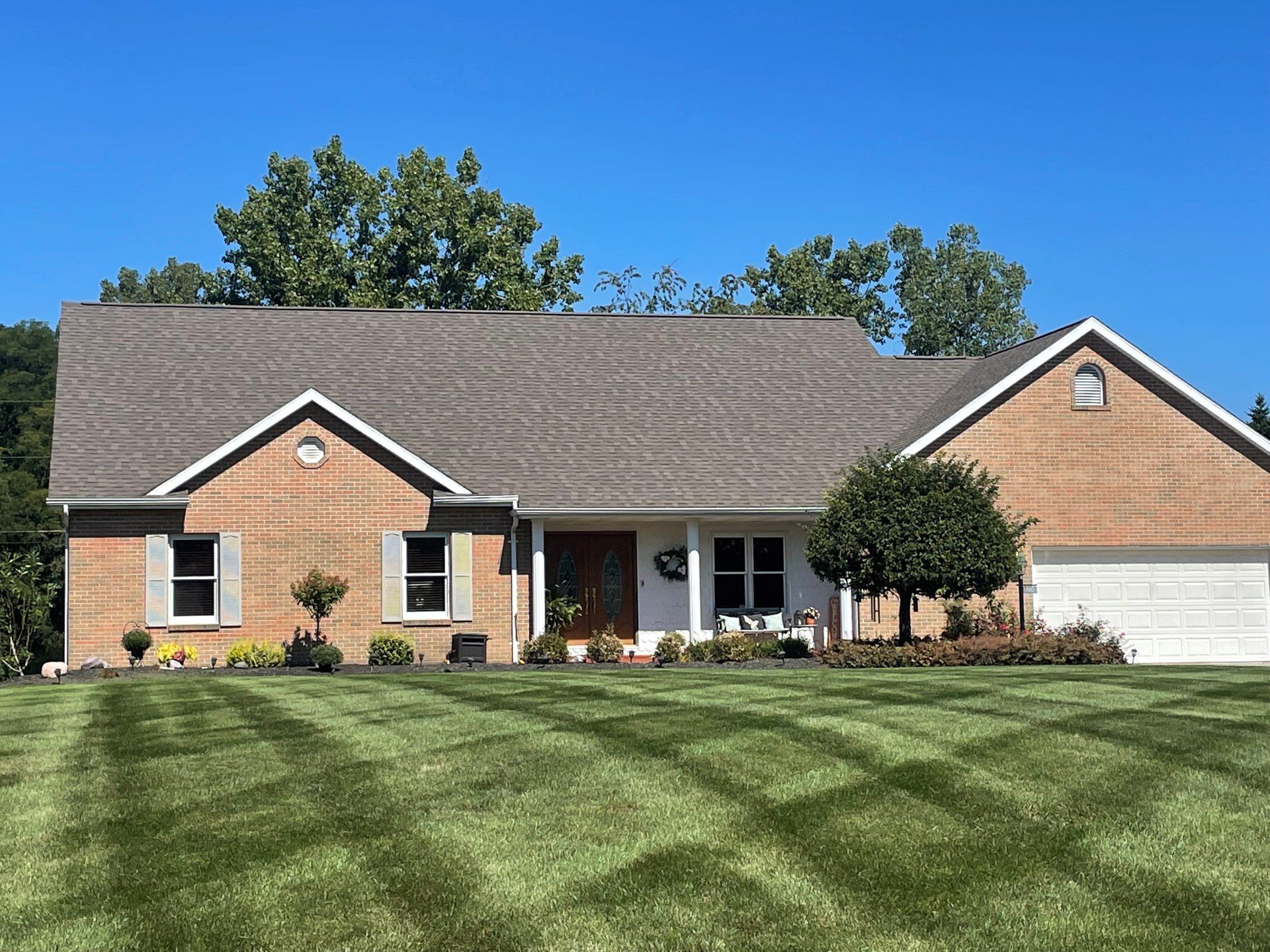 Huge brick house and asphalt roofing