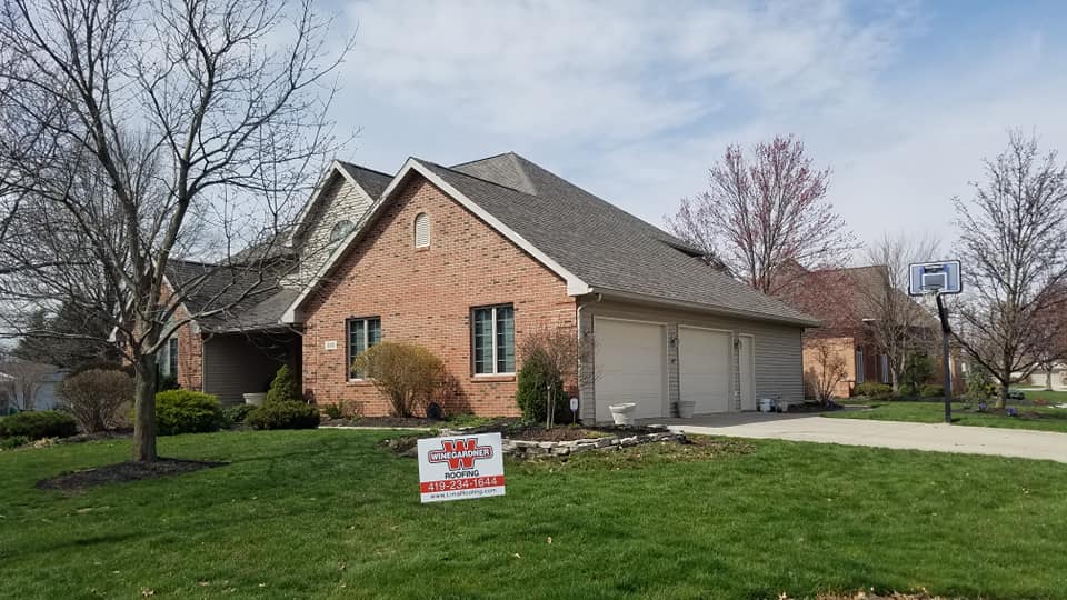 Brick house with asphalt roofing