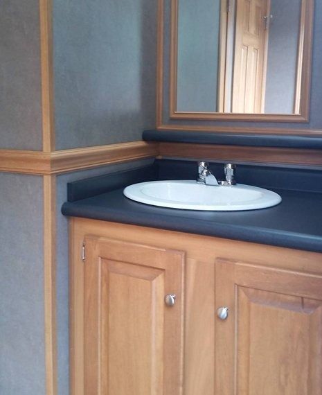 A bathroom vanity with a sink and a mirror