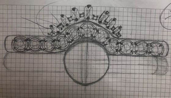 a black and white drawing of a ring on a piece of graph paper
