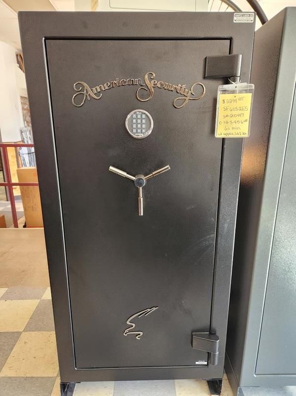 Black American Security safe with combination lock and handle, in a store.
