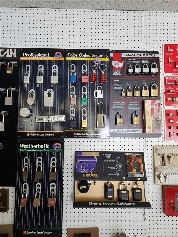 Lock display at a hardware store with various padlocks on display boards.