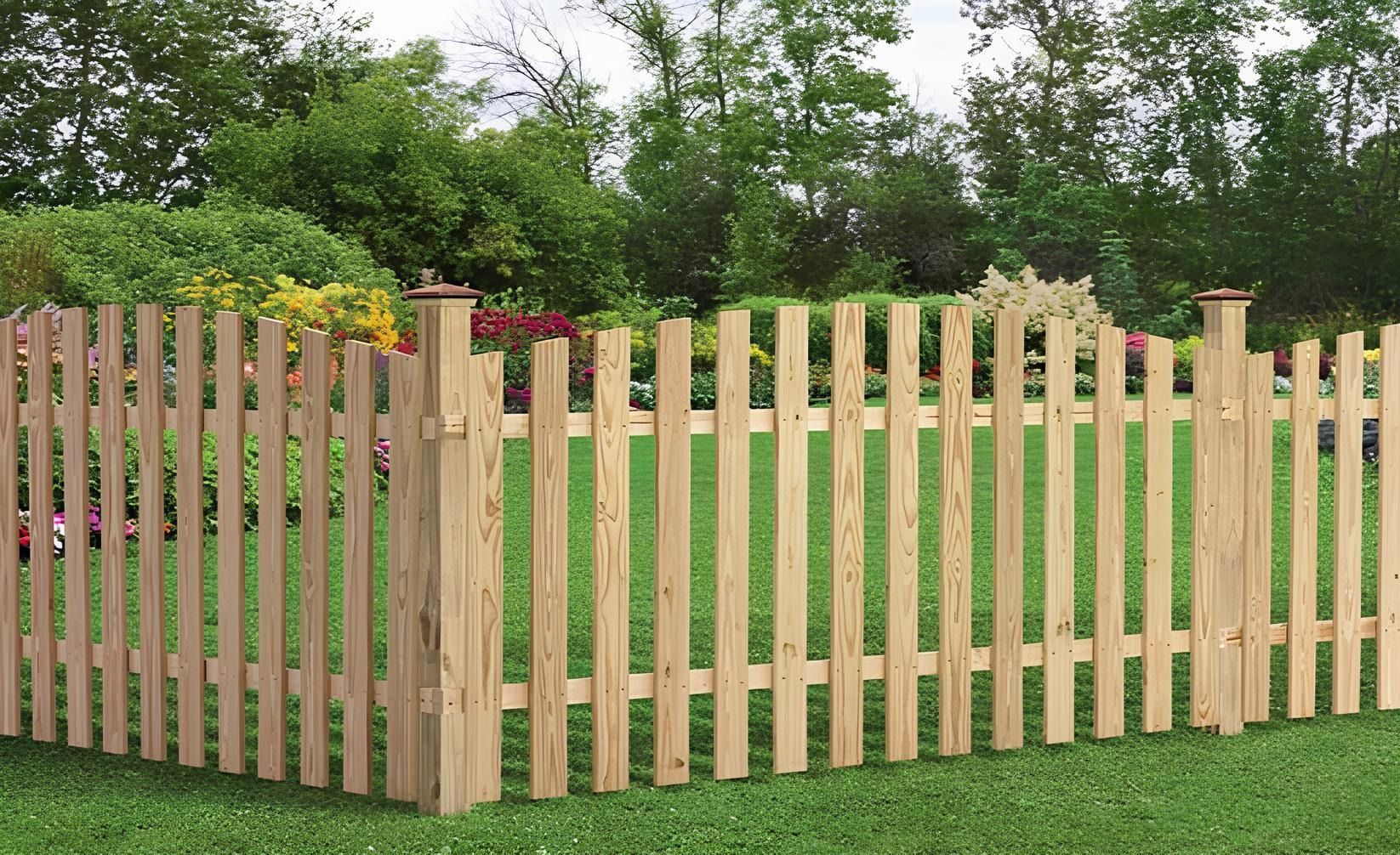 Wooden picket fence in a grassy yard, with trees and foliage in the background.