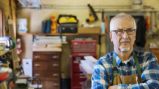 Old man in front of work station
