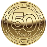 It is a gold coin that says `` window film innovation keeping you protected ''.