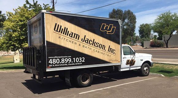 A william jackson inc. truck is parked in a parking lot.