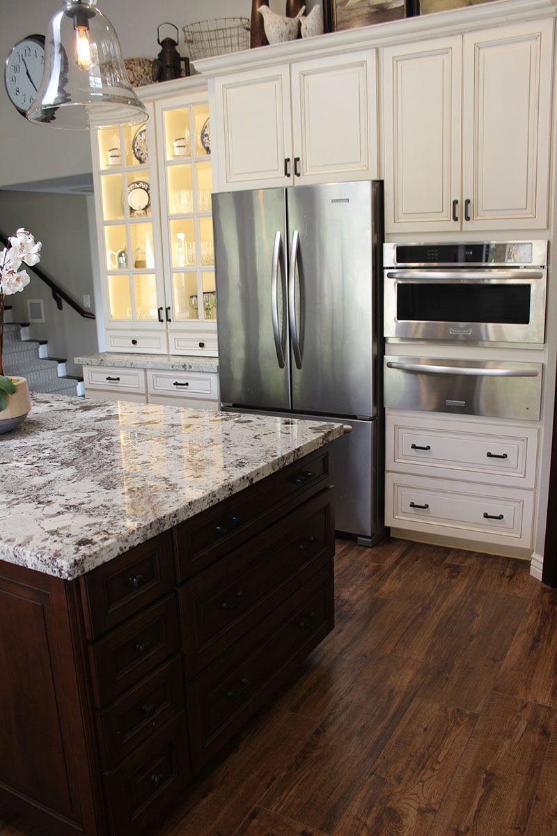 A kitchen with stainless steel appliances and granite countertops.