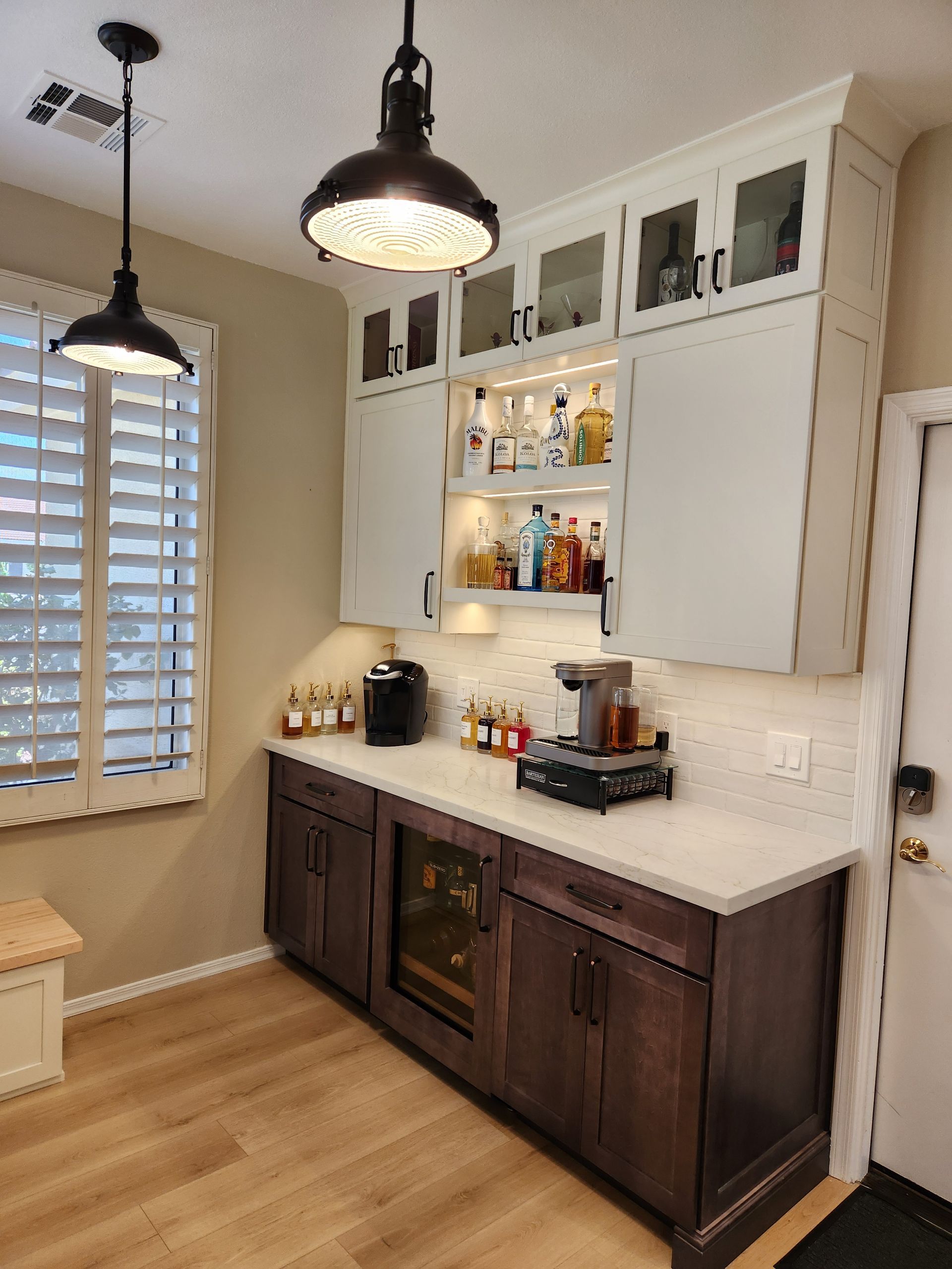 A kitchen with lots of cabinets and a refrigerator