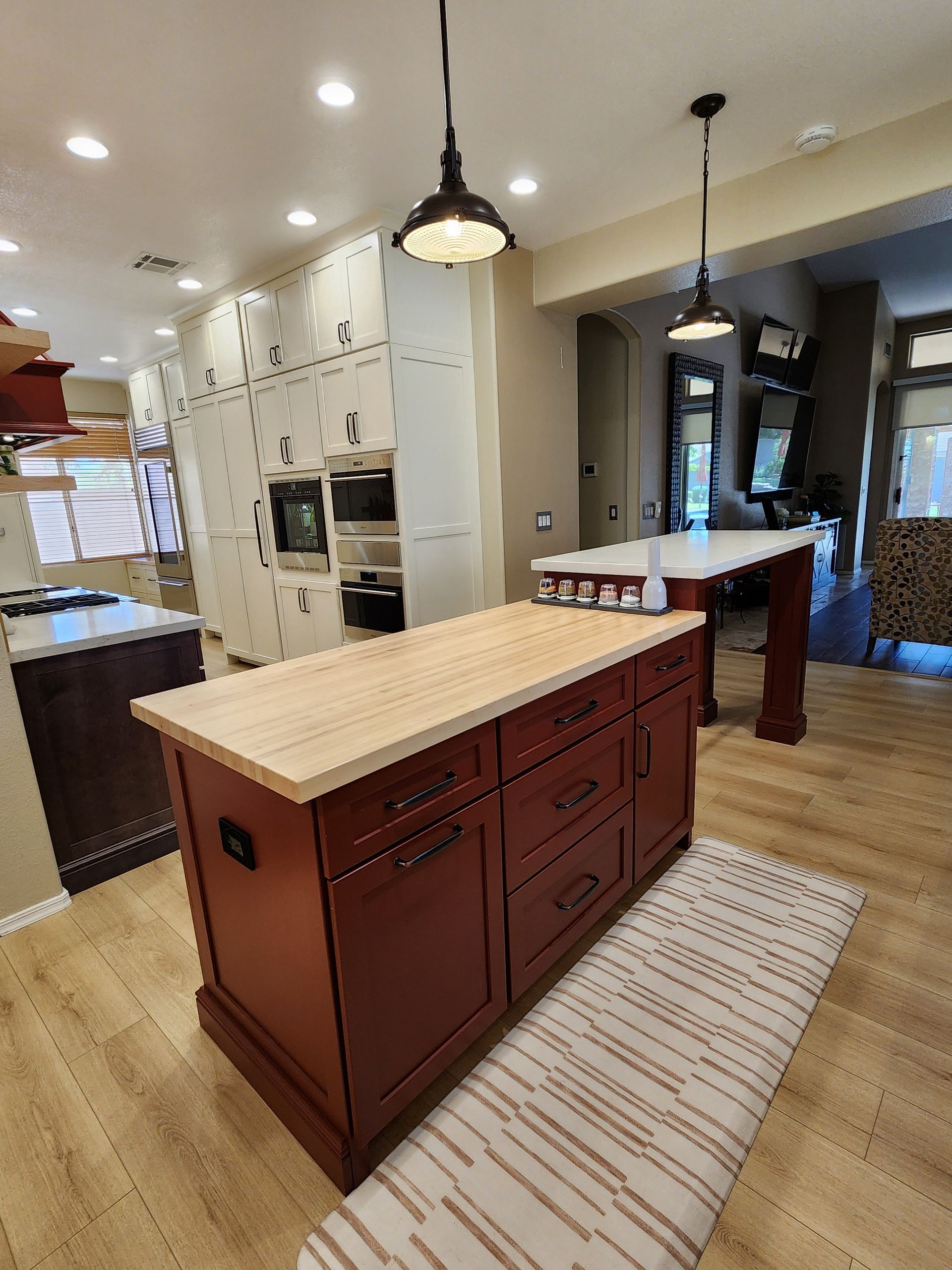 A kitchen with a large island in the middle of it.