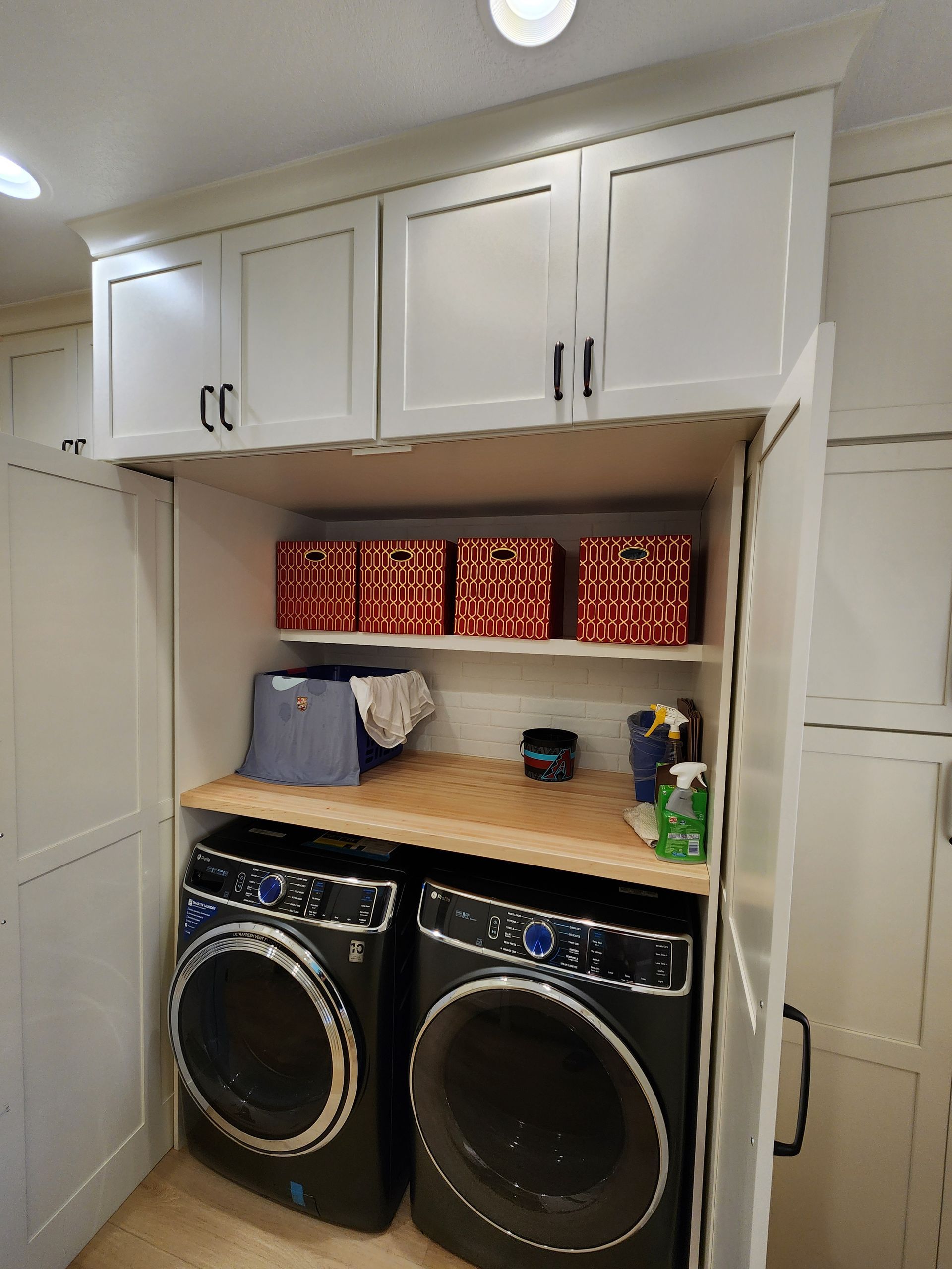 A laundry room with a washer and dryer in it