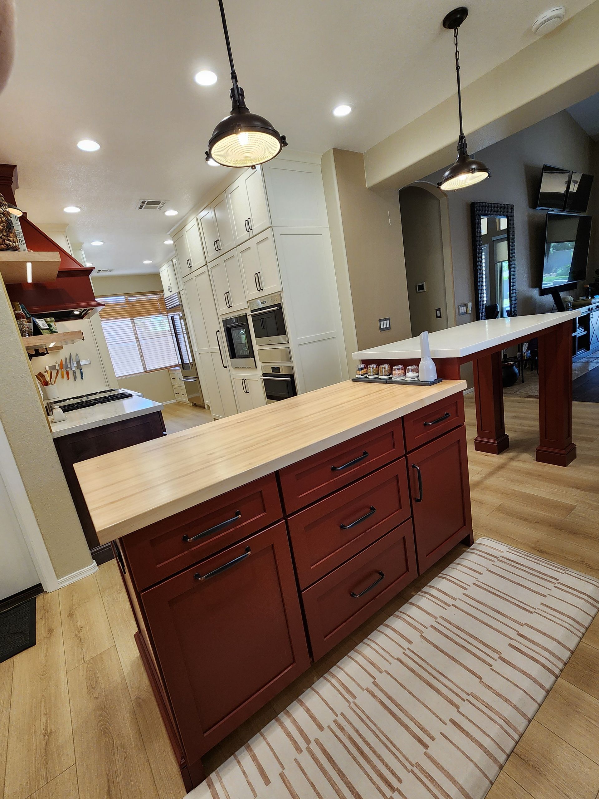There is a large island in the middle of the kitchen.
