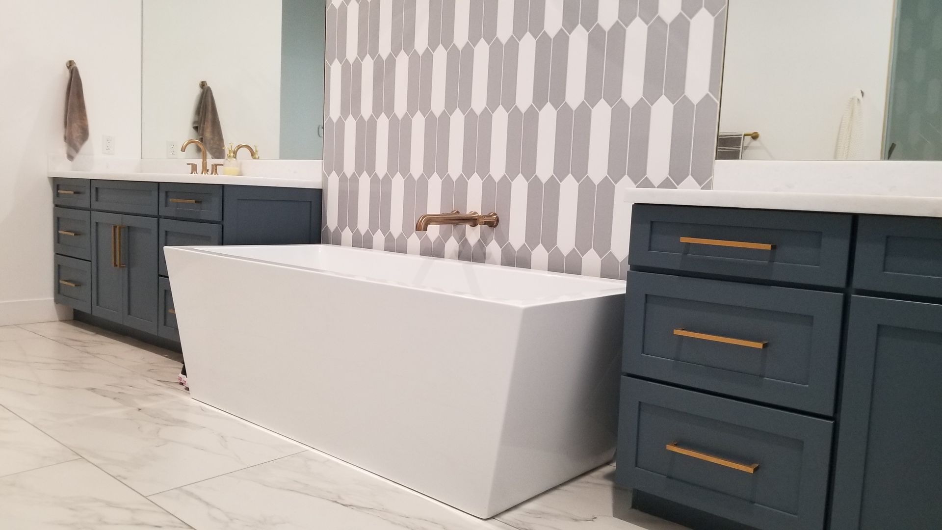 There is a bathtub in the middle of the bathroom.