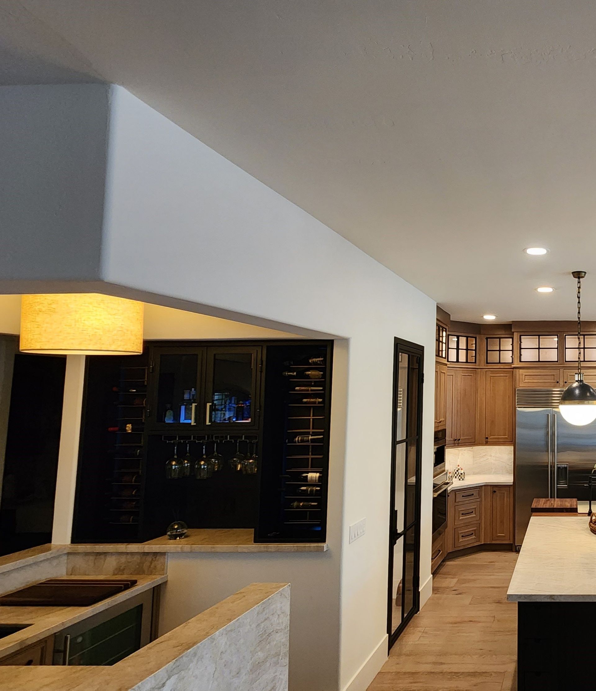 A kitchen with stainless steel appliances and wooden cabinets