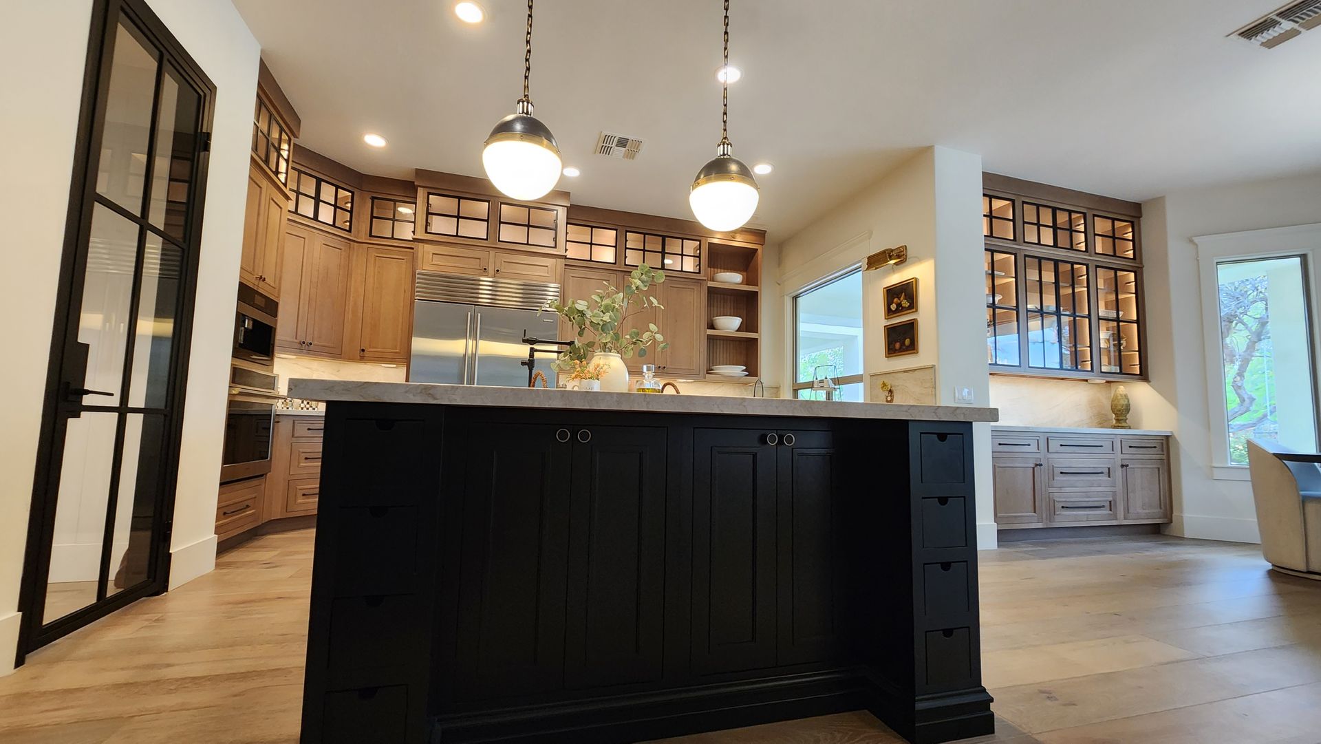 A beautiful kitchen with a large island in the middle of it