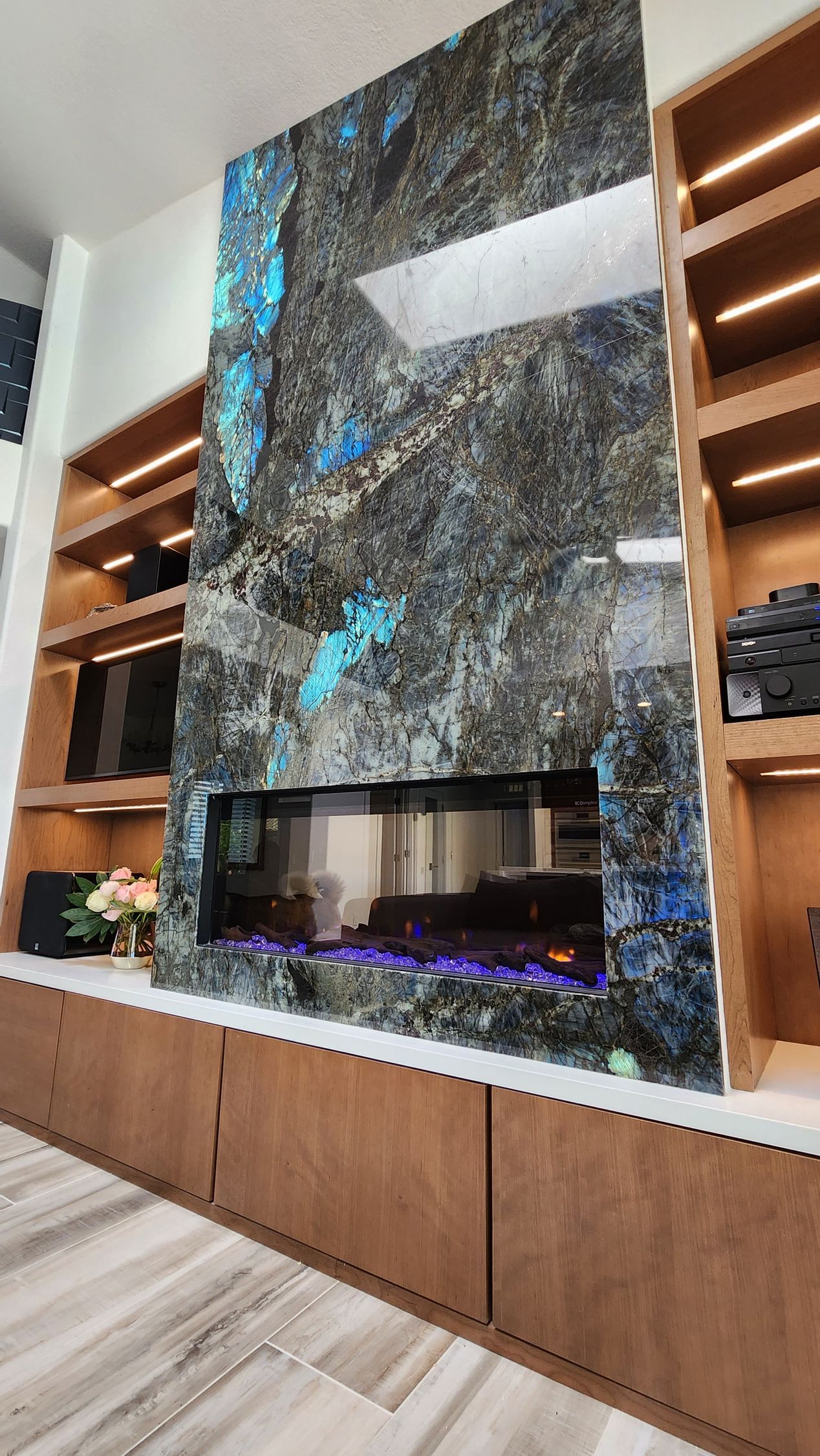 There is a fireplace in the middle of the room.