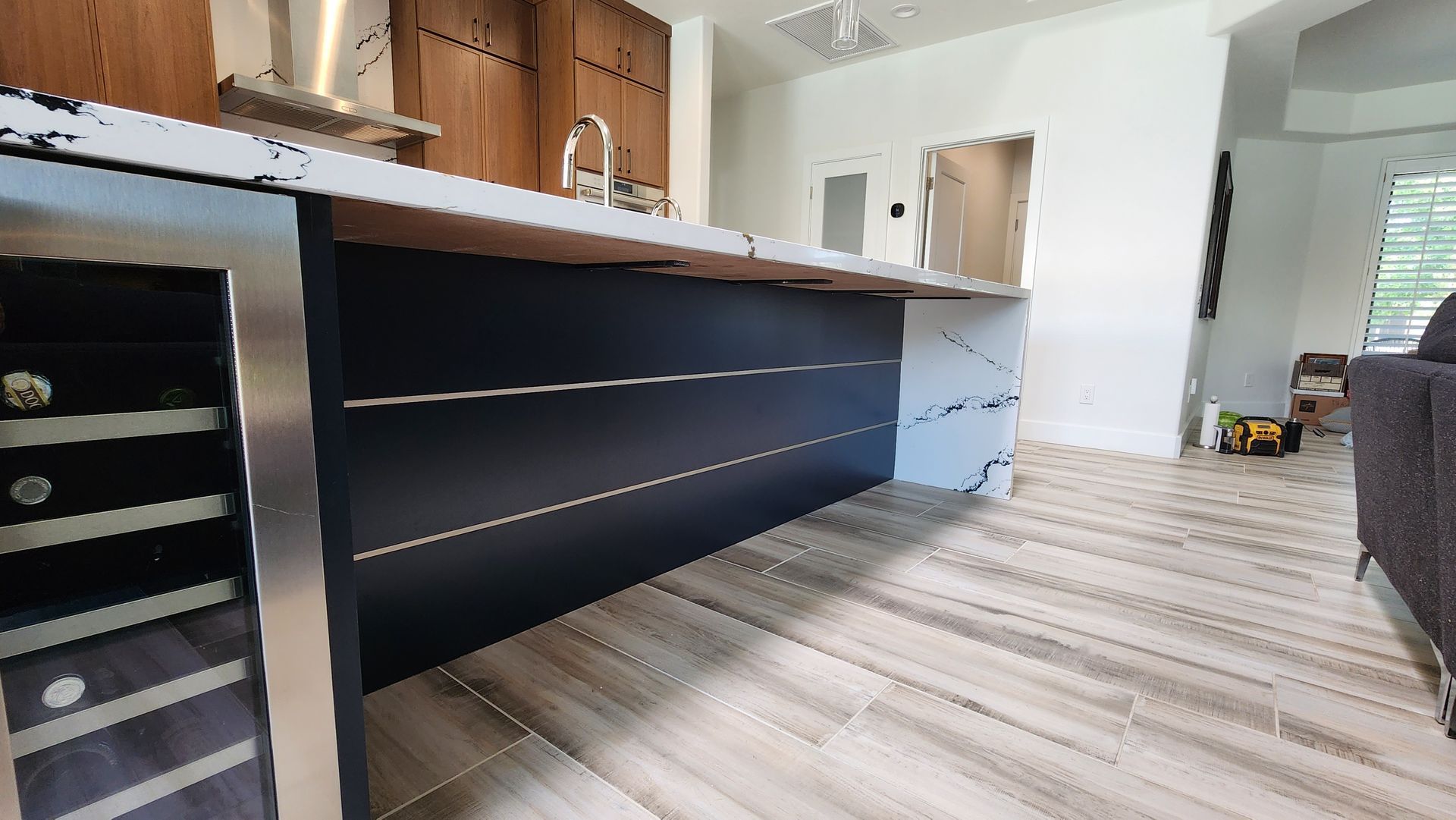 A kitchen with a large island in the middle of the room