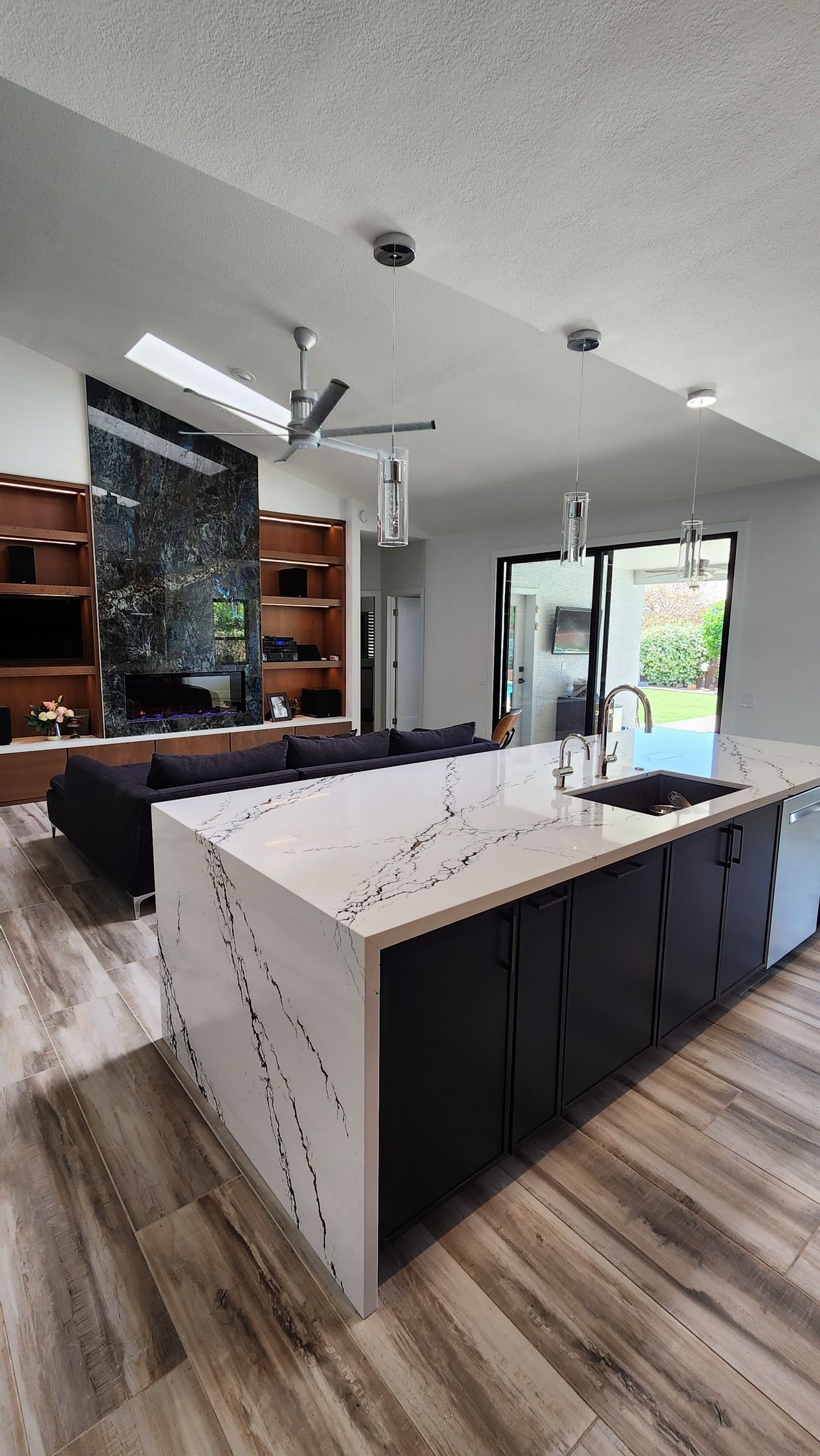 A kitchen with a large island in the middle of the room.