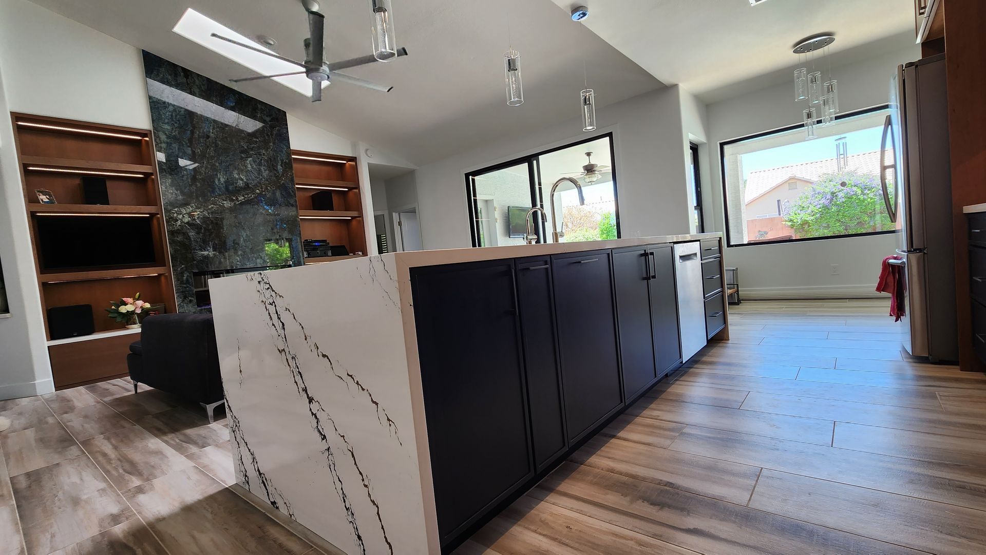 A nice-looking kitchen with a large island in the middle of the room.