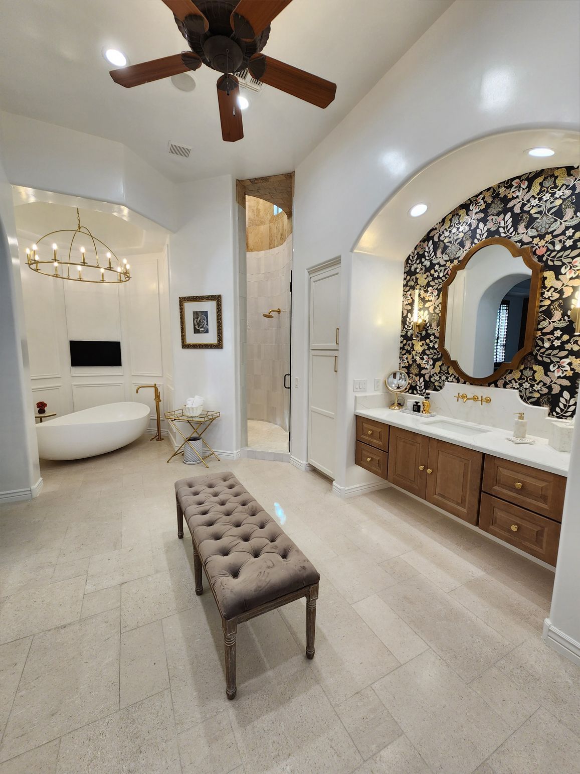 There is a bench in the middle of the bathroom.