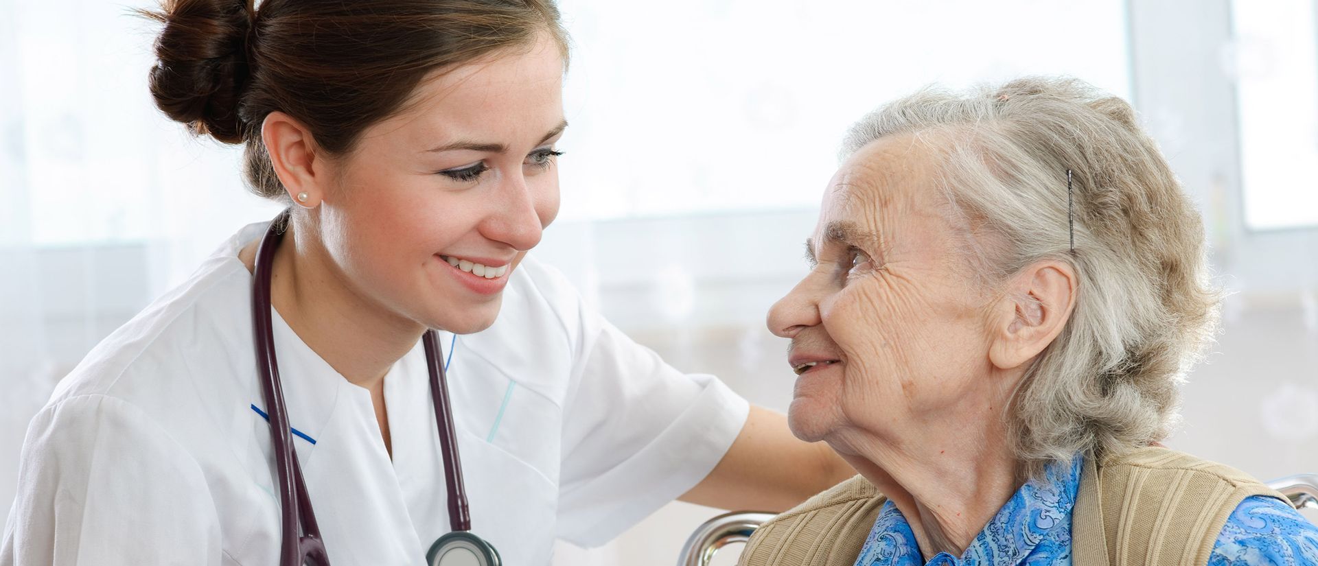 Happy elderly with health aide