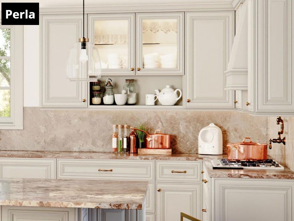 A kitchen with white cabinets and a marble counter top.